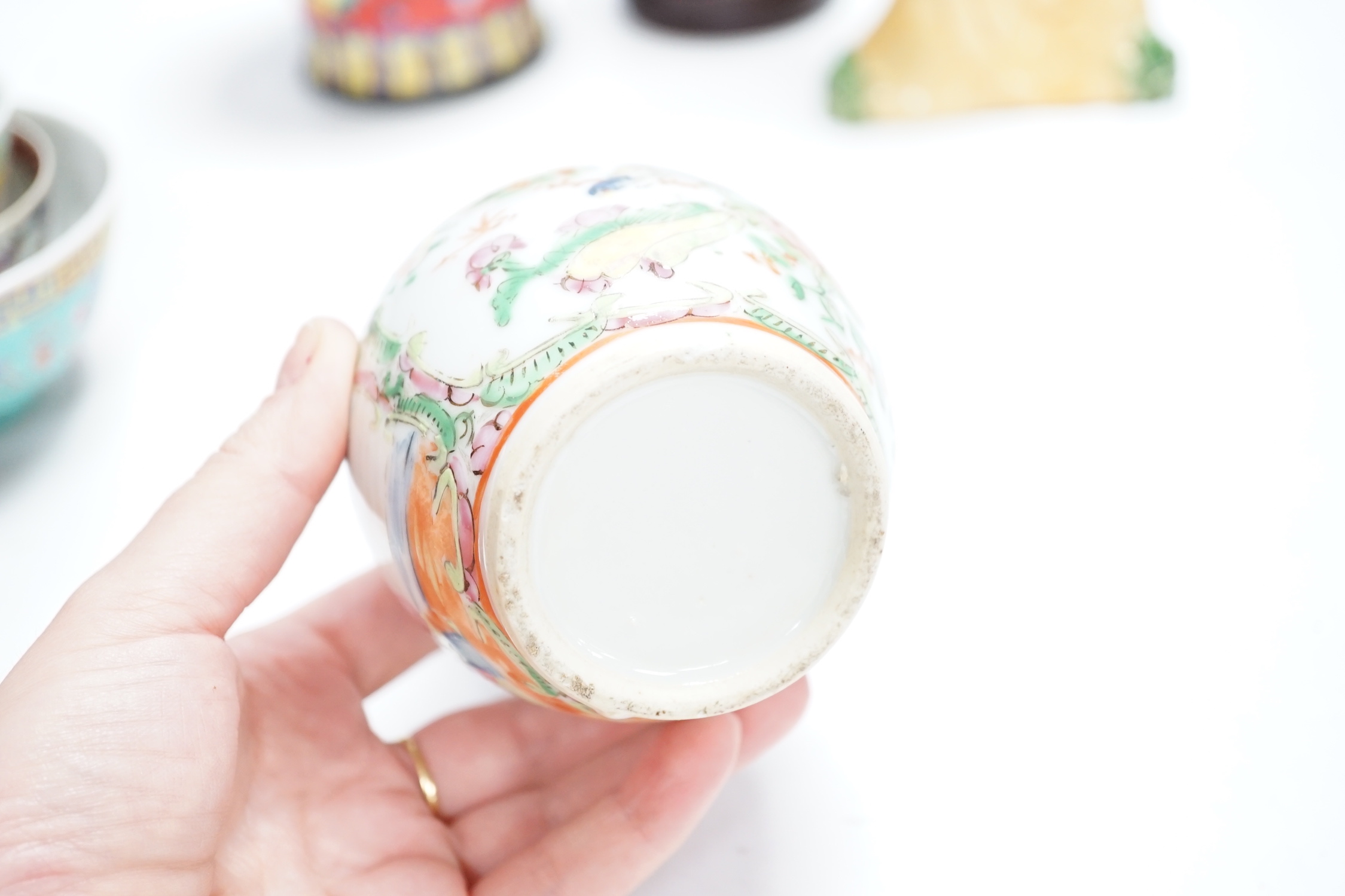 A group of Chinese ceramics 18th century and later, including a bottle vase, a water pipe vessel, box and cover, three bowls, a Tang style figure of a lady, a Yixing teapot, together with a resin figure of an emperor